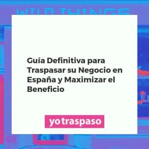 Empresarios negociando el traspaso de un negocio en España, con documentos y herramientas financieras